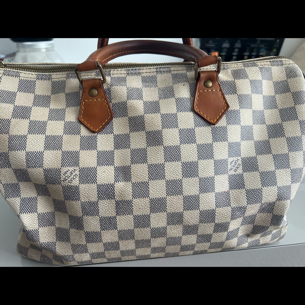 authentic Louis Vuitton handbag.